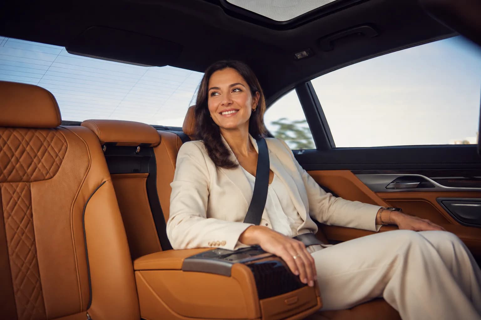 Executive passenger enjoying a comfortable ride in a luxury Boston car service vehicle